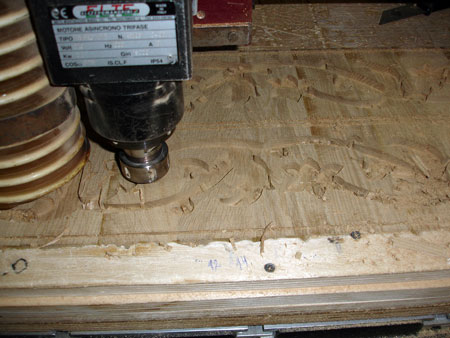 Modern, Italian made CNC router is used to precisely cut wood for inlays
