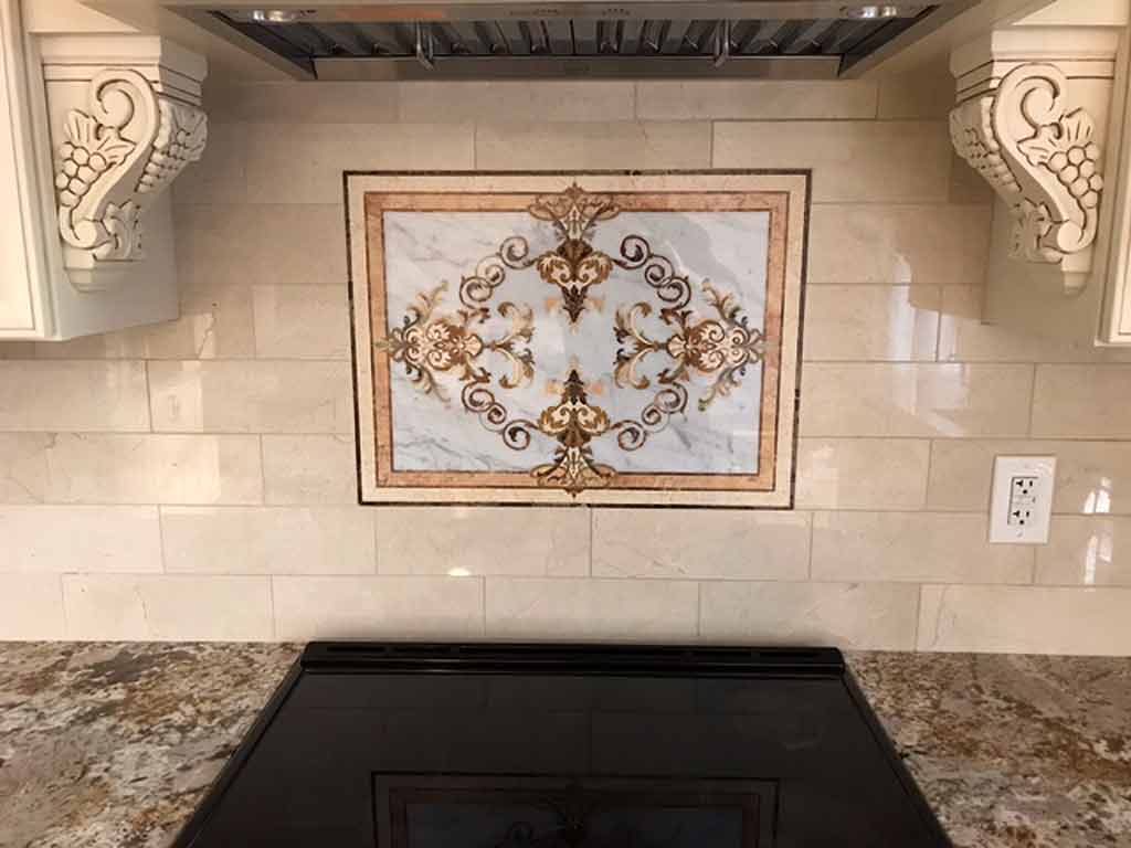 A custom marble backsplash embedded into Crema Marfil subway tile adds depth and warmth to the space.