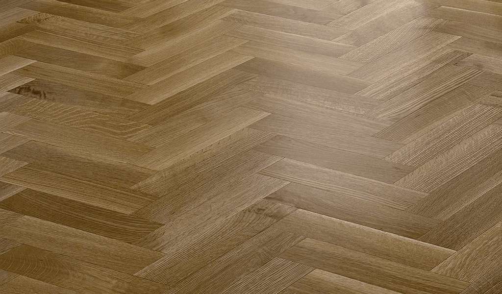 Classic White Oak herringbone wood flooring installed in a grand room with high ceilings. Precision-milled decorative hardwood floor layout handcrafted in the USA by Czar Floors.