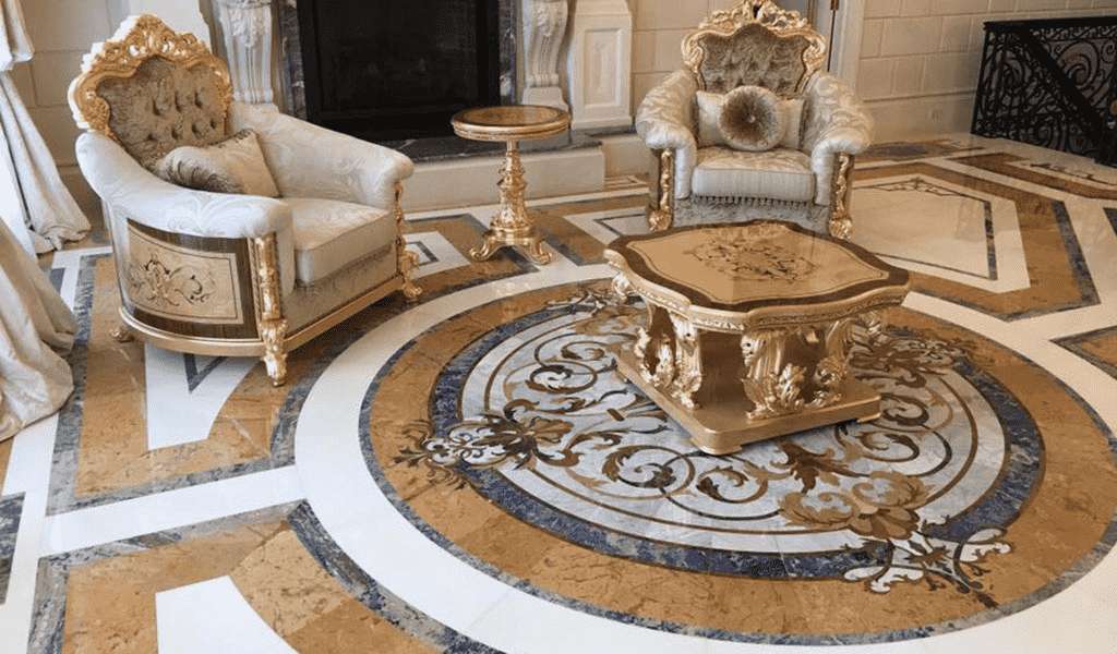 Grand luxury ballroom featuring an expansive custom marble floor medallion with intricate classical scrollwork. Opulent interior design showcasing artisanal stone inlays by Czar Floors.