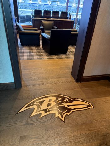ID:723; A Ravens raven-head medallion inlaid right into the suite floor at the stadium