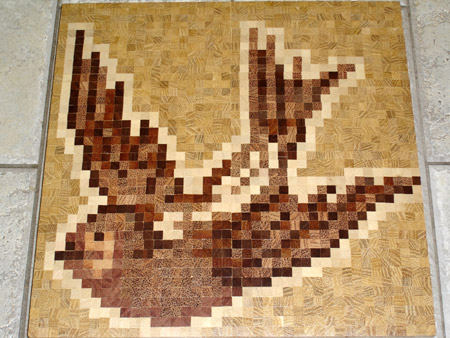 129: Border corner made using wood mosaic