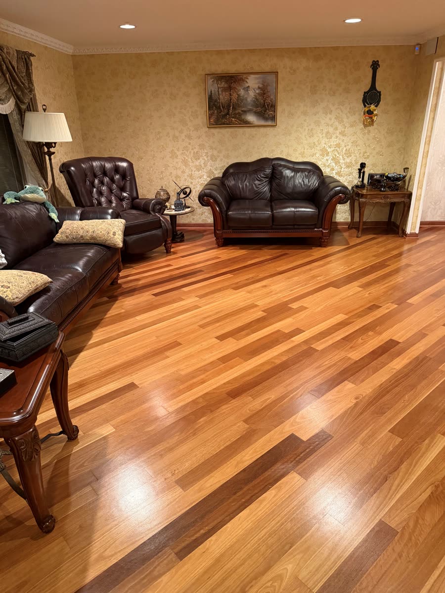 Customer living room before — plain hardwood floor
